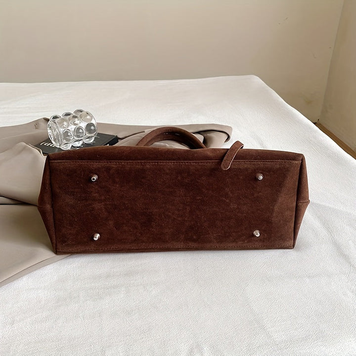 Valsenia Elegant bag with vintage suede belt